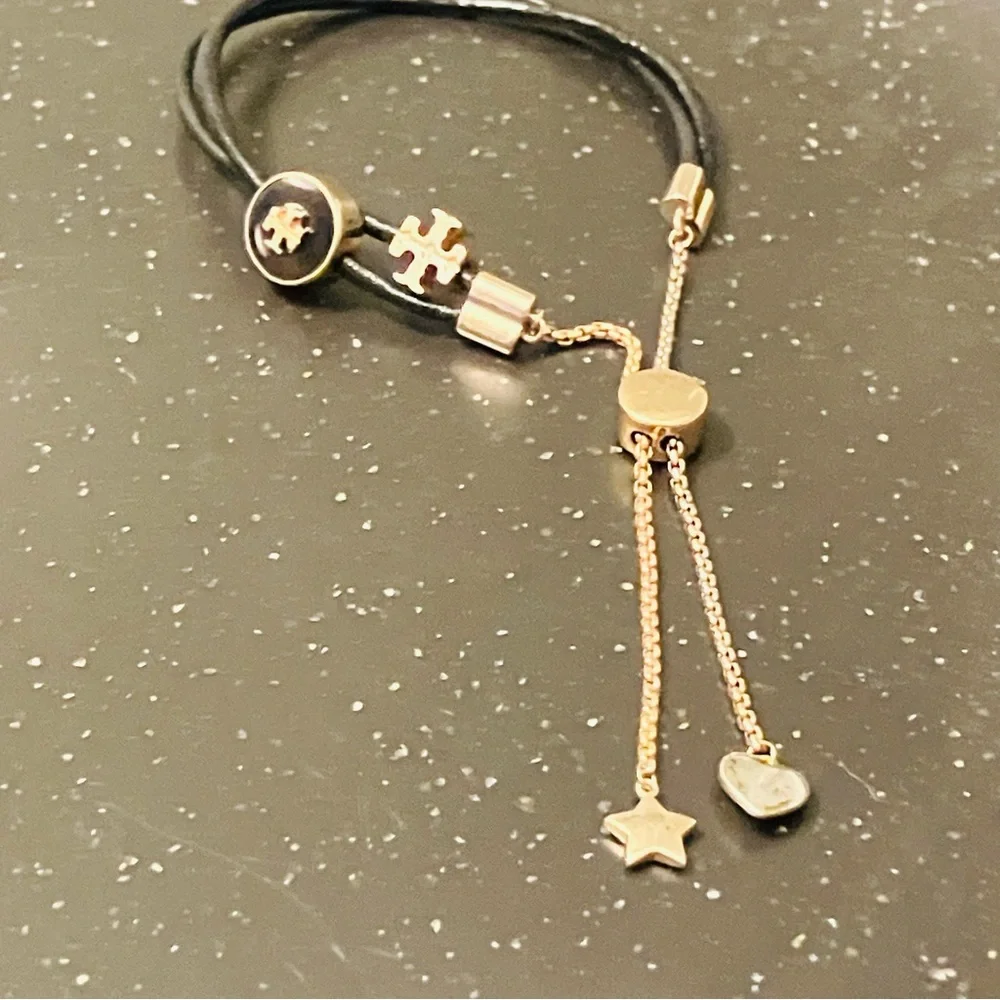 Tory Burch-Kira Double Leather Slider Bracelet in Black and Gold. Shows min wear